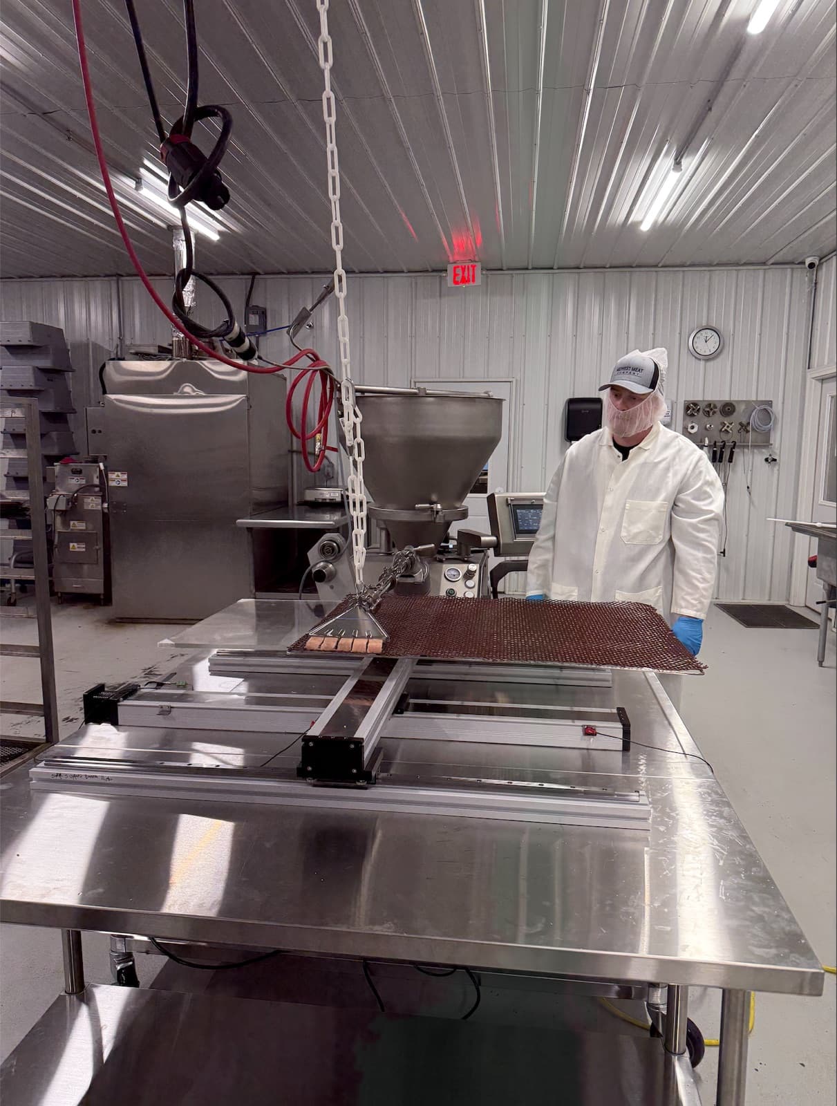 Operator running the Meat Bot at Midwest Meat